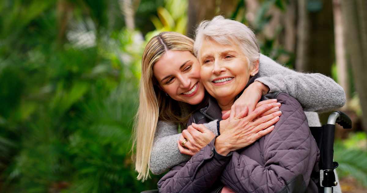 an image of an adult daughter hugging her mother