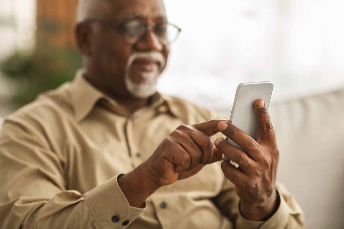 Man focused on smartphone
