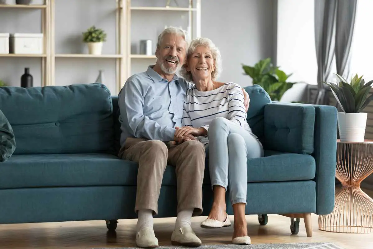 image of older couple sitting on a couch