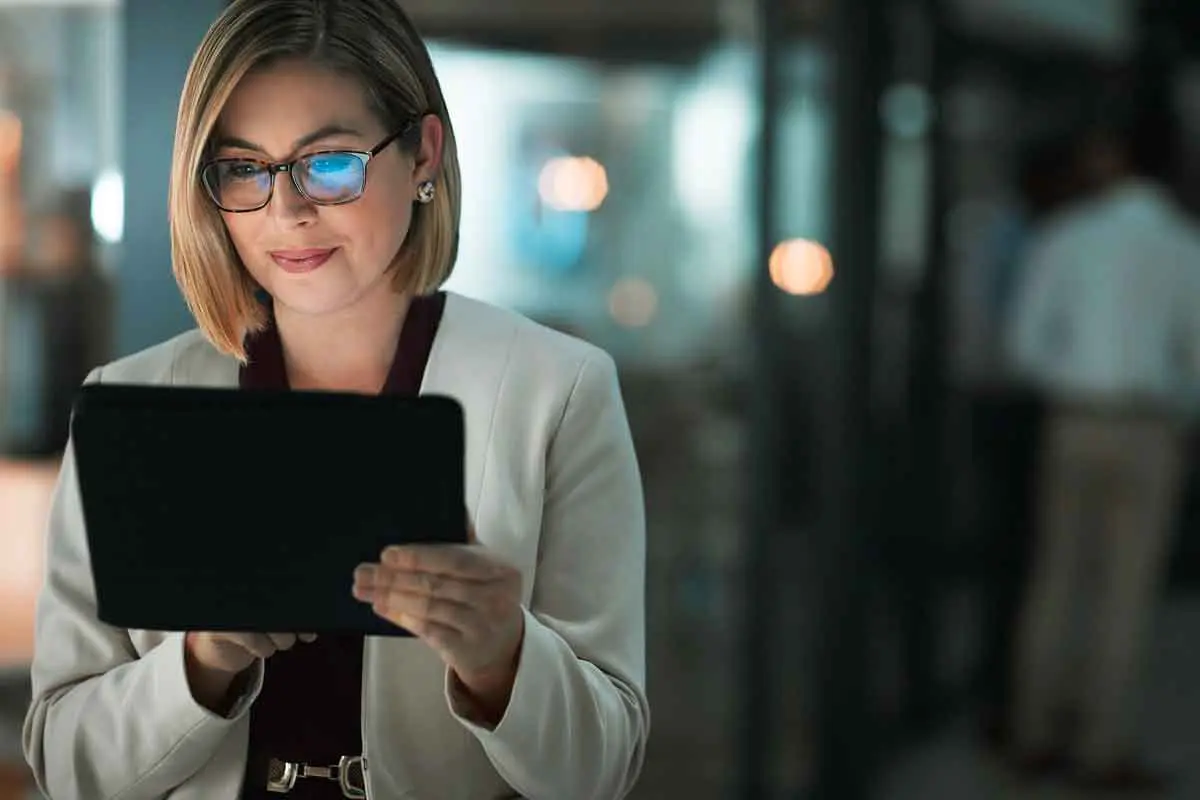 An adult child checking on a parent remotely from a tablet